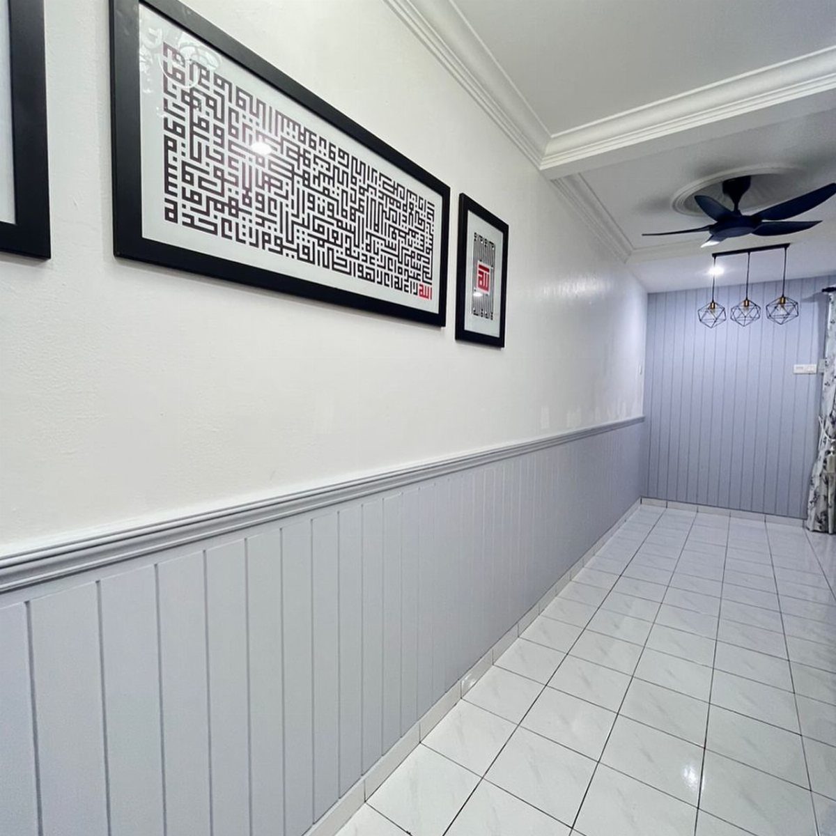 10 Accent Wall Panels for Every Room Style 6 Light grey vertical wainscoting panels installed on the lower half of a white hallway wall.