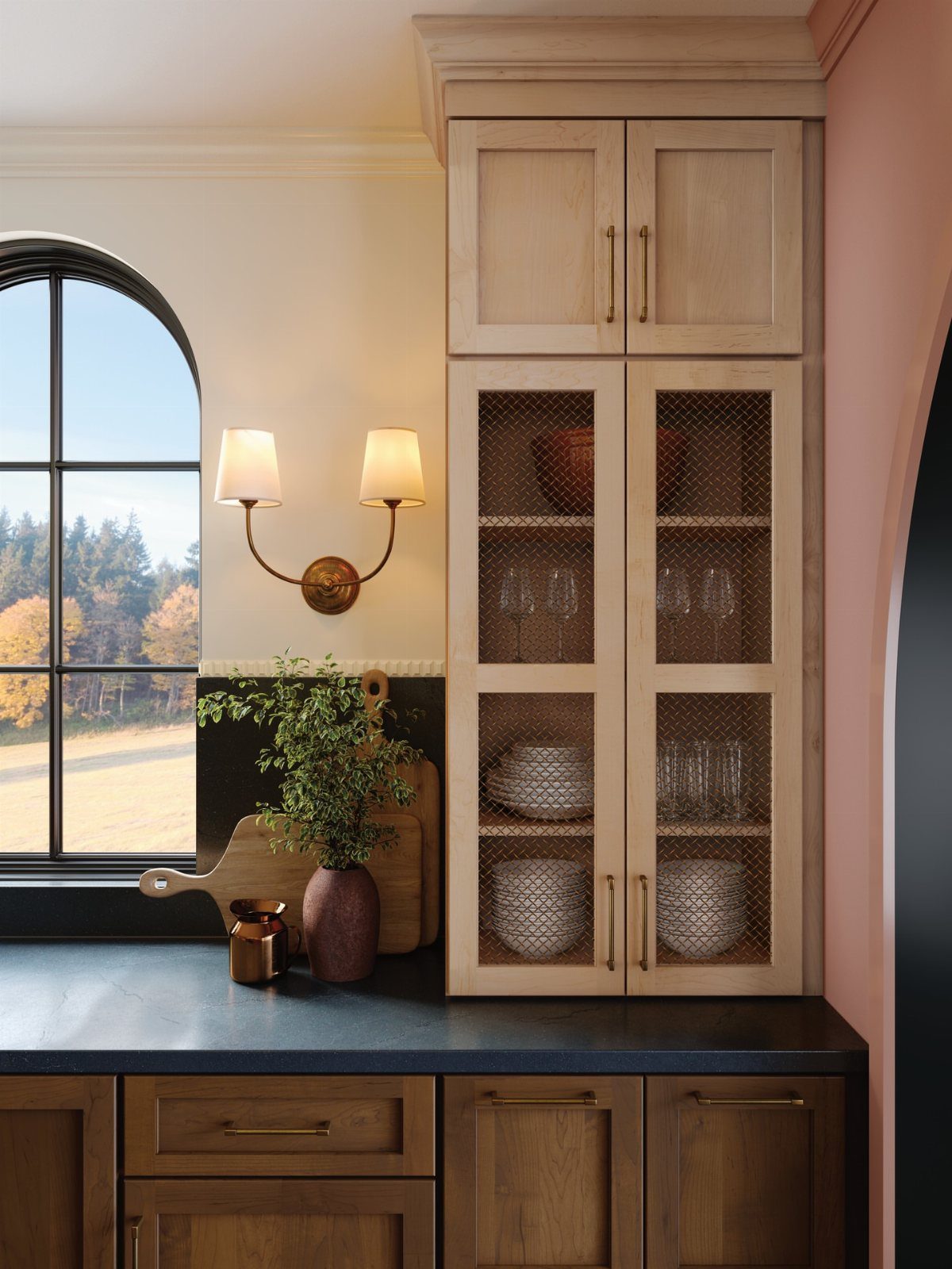 Dark Wood Floors with Light Wood Cabinets: 10 Kitchen Pairings 5 Light wood upper cabinets with mesh doors sit above dark wood lower cabinets and a black countertop.