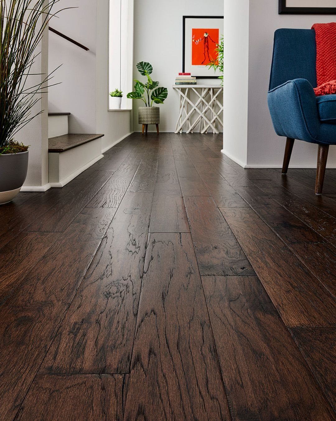 Fancy Wood Floors: 8 Ideas for Rich, Character-Filled Spaces 7 Dark wide-plank hardwood floors with a textured grain in a modern living room setting.