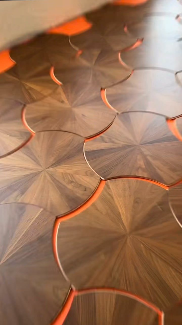Fancy Wood Floors: 8 Ideas for Rich, Character-Filled Spaces 6 Intricate parquet wood flooring with starburst patterns and bright orange inlay lines.