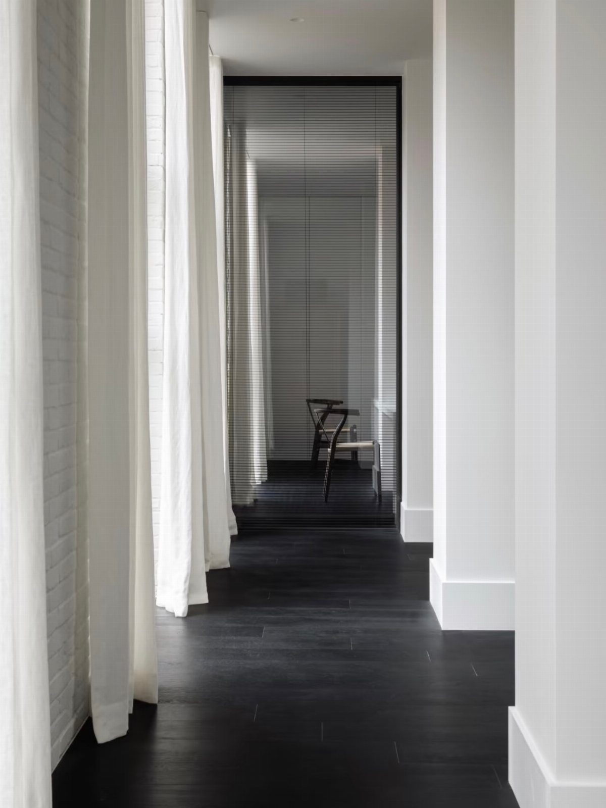 Floor and Wall Color Combinations: 27 Rooms That Get It Right 18 Dark wood floors meet white walls in a minimalist hallway with long white curtains.