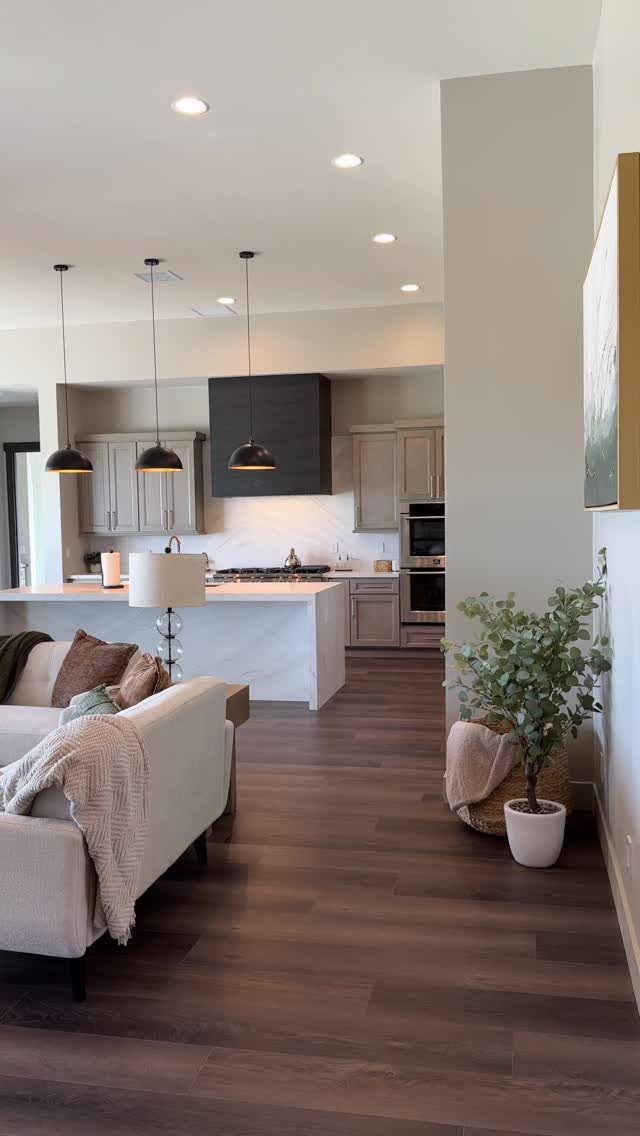 Floor and Wall Color Combinations: 27 Rooms That Get It Right 22 Dark wood flooring meets light beige walls in a modern open-concept living and kitchen space.