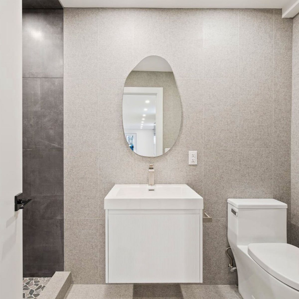 Floor and Wall Color Combinations: 27 Rooms That Get It Right 15 Light gray tiled bathroom walls and floor with a white vanity and toilet.