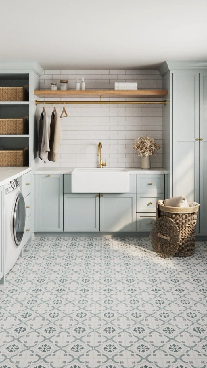 Floor Tile for Laundry Room: 11 Styles That Hold Up to Real Life 1 Patterned blue and white ceramic floor tiles in a bright, modern laundry room setting.