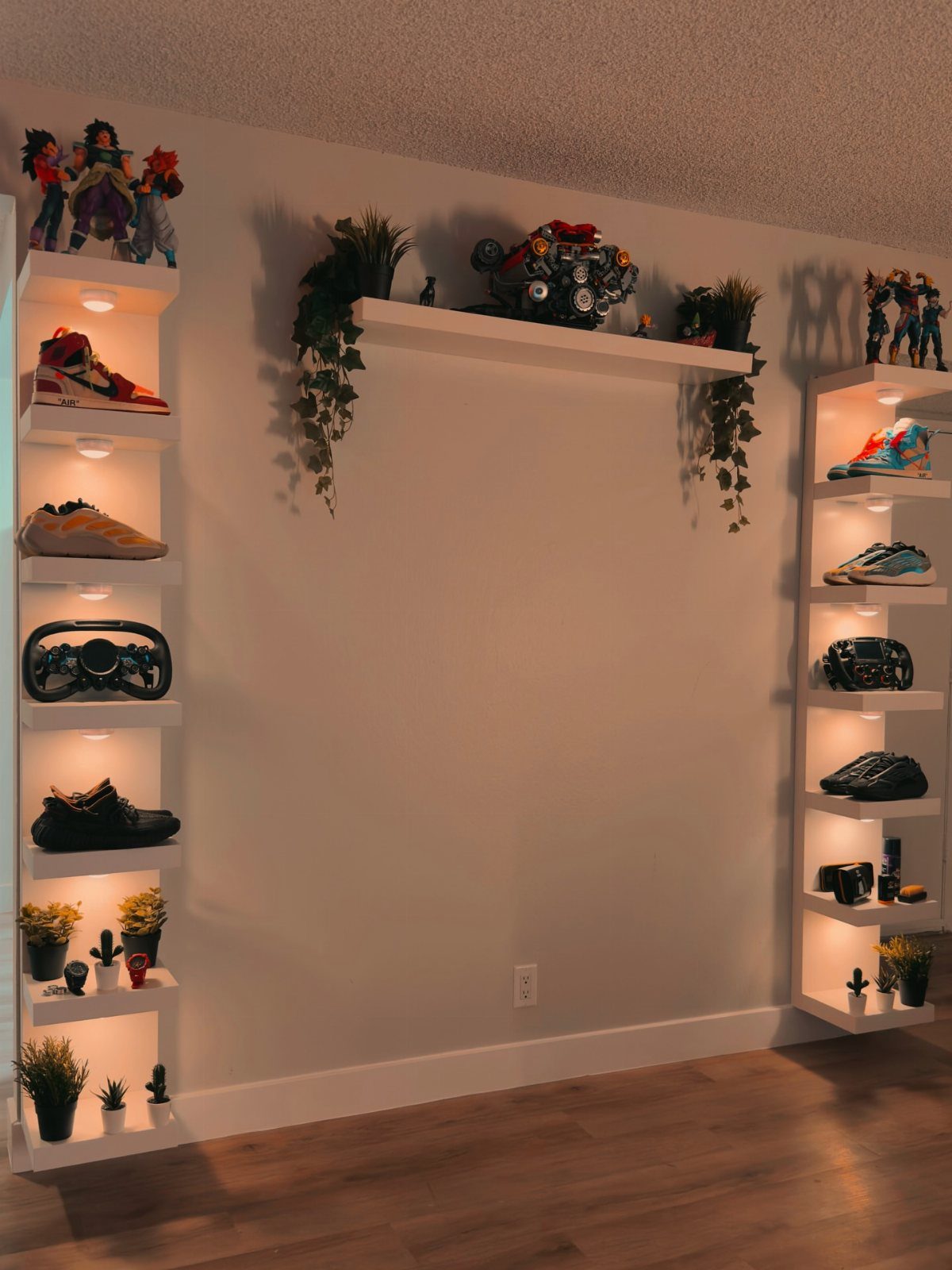 10 Interior Walls Ideas for 2026: Colors, Textures & Clever Details 7 White built-in wall shelves with integrated lighting displaying sneakers, plants, and collectibles.