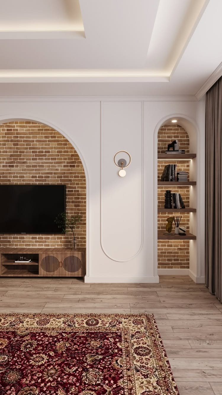 Television mounted on a brick wall inside an arched alcove next to built-in shelving.