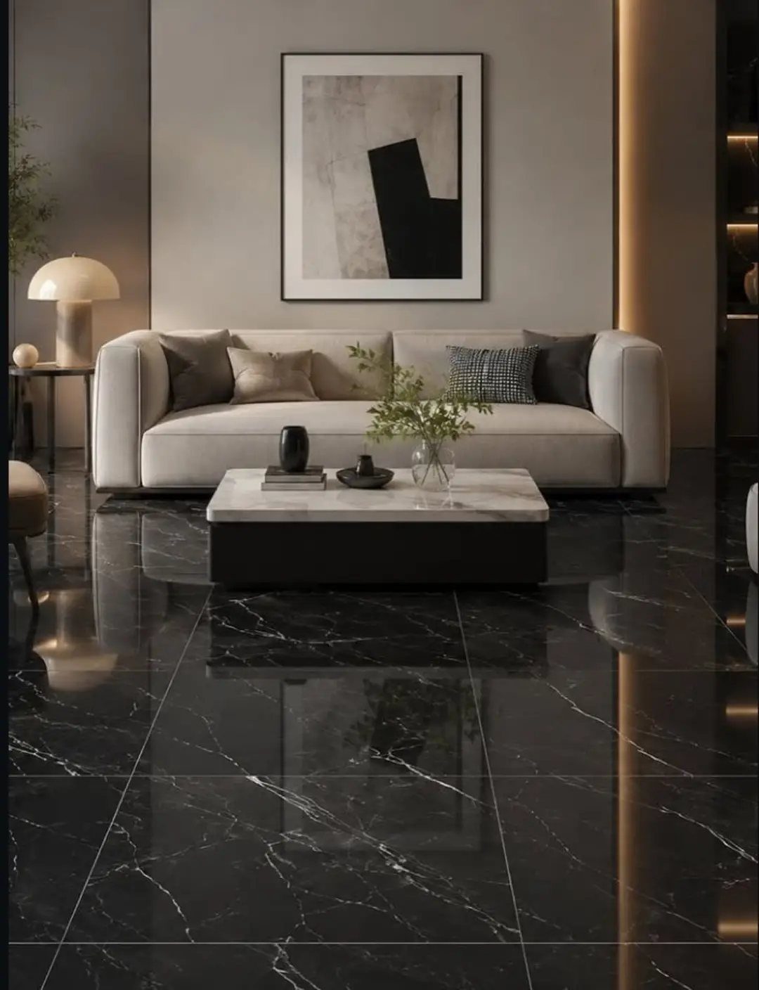 Polished black marble floor tiles with white veining in a modern living room setting.