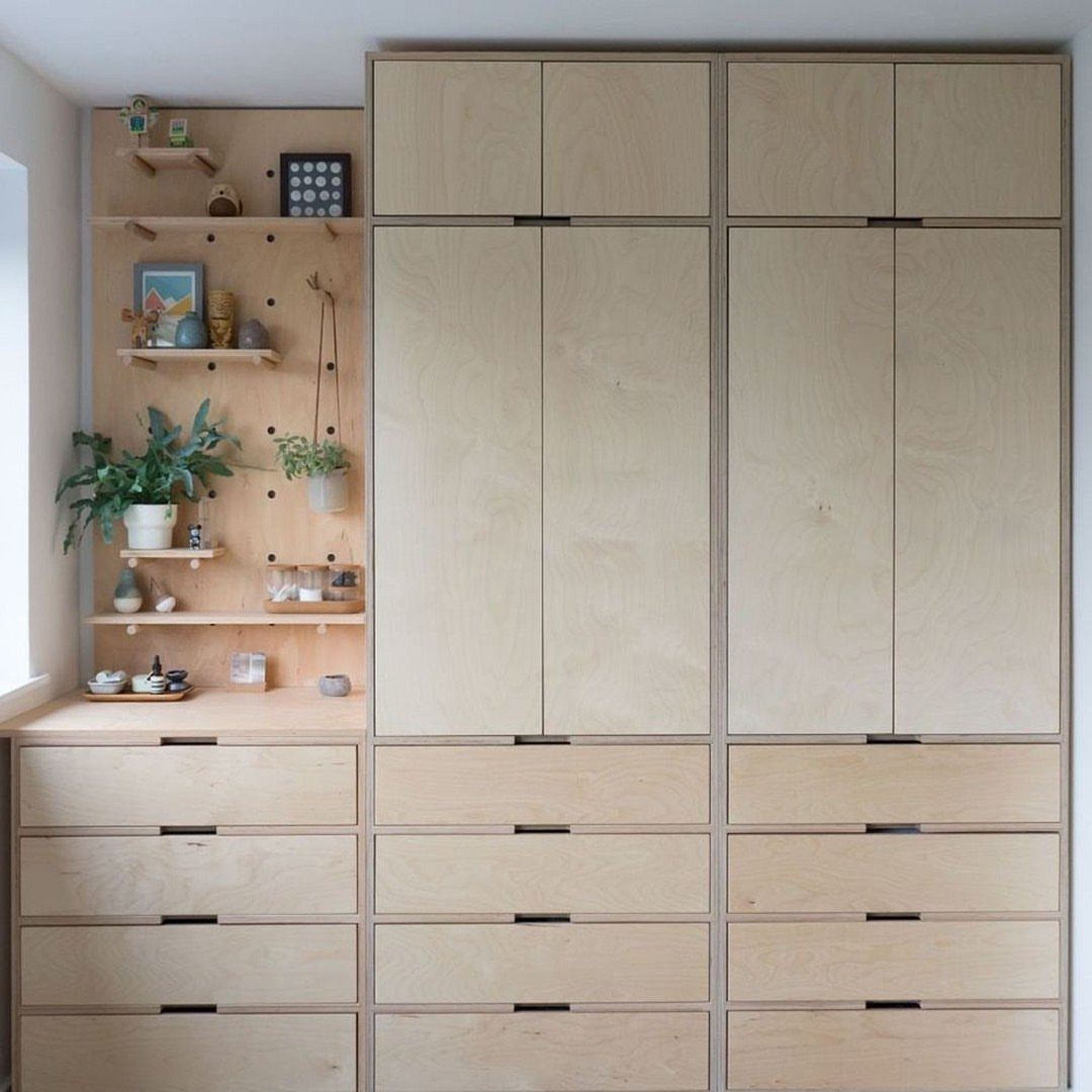12 Plywood Wall Ideas for Living Rooms, Offices and Bedrooms 1 Light plywood cabinetry featuring a pegboard wall with small wooden shelves and decorative items.
