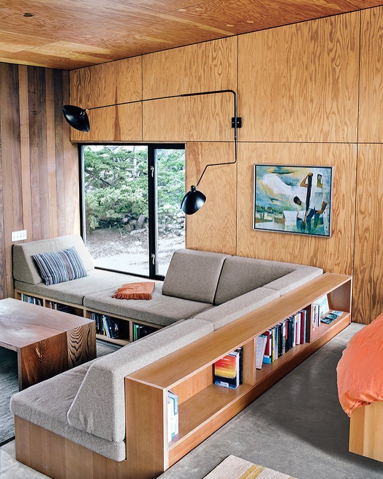 12 Plywood Wall Ideas for Living Rooms, Offices and Bedrooms 9 Plywood wall panels and ceiling in a modern living room with a grey sofa.