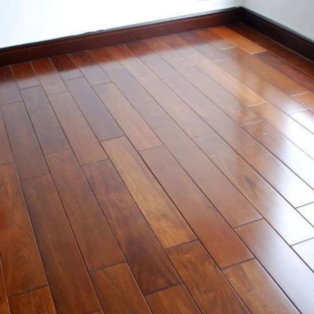 5 Random Wood Floor Pattern Ideas for Your Home 3 Dark polished wood floor planks of varying lengths installed in a room with white walls.