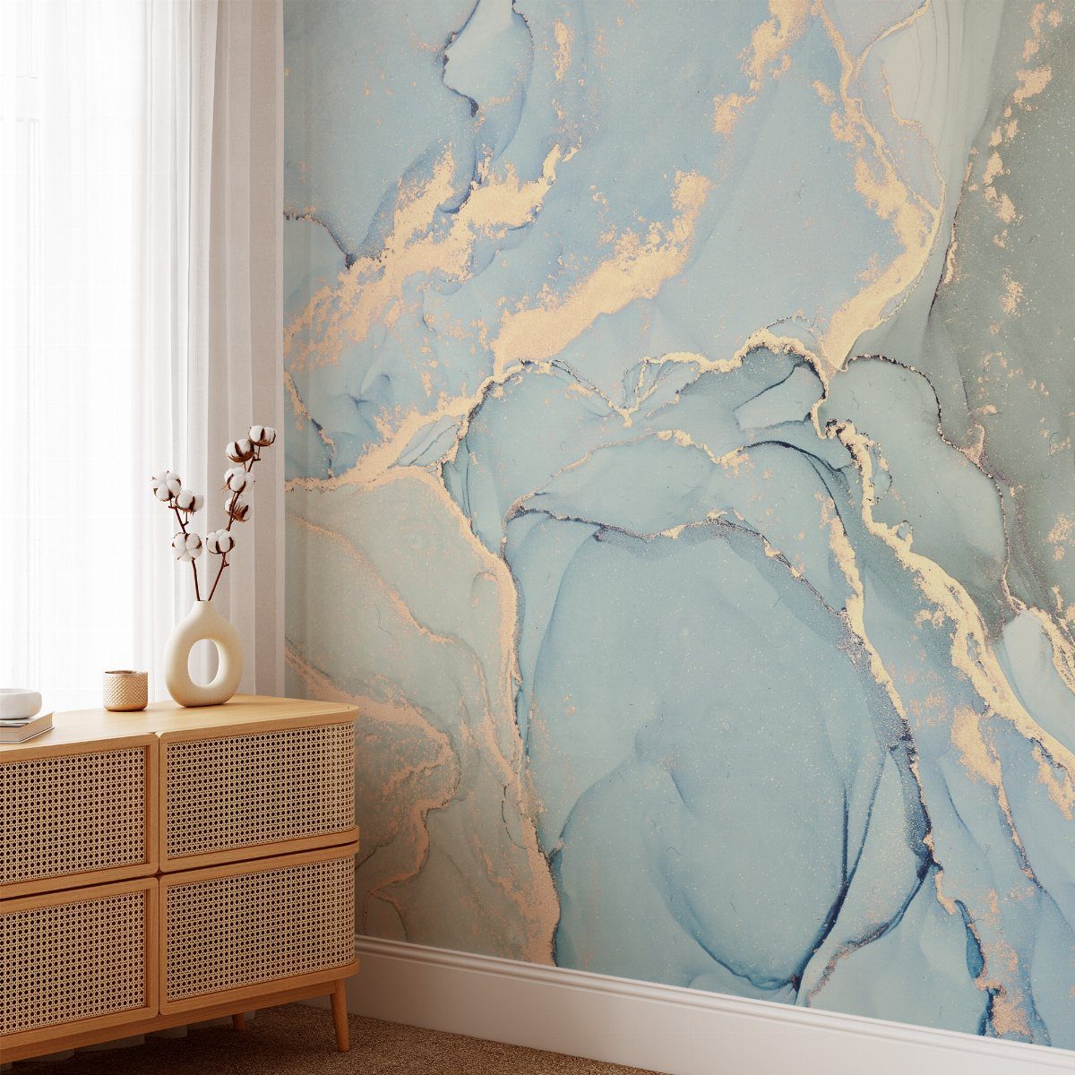 Soft blue and gold marble patterned wallpaper on an accent wall in a bright room.